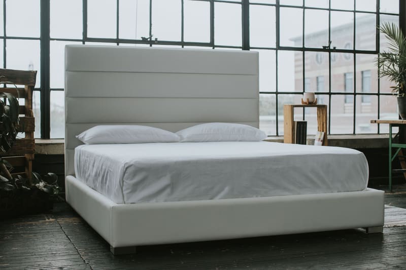 The Zazen Bed from the side: low platform, horizontal channel headboard