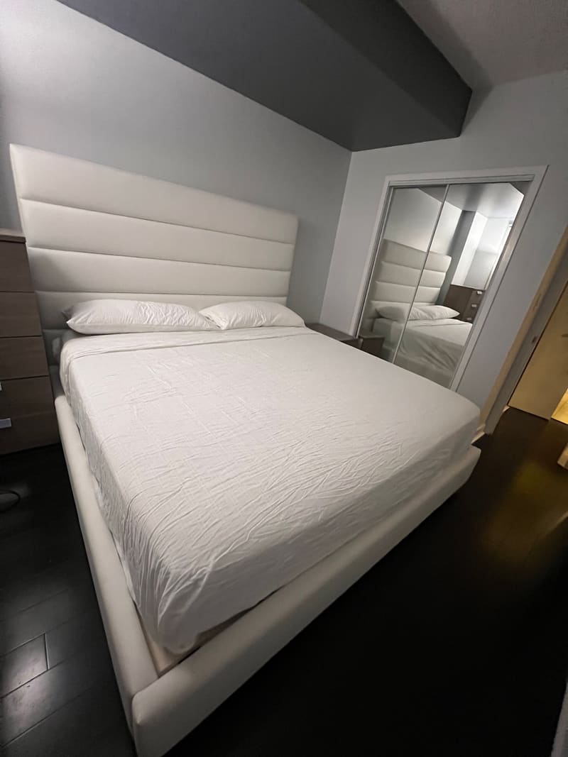 A white Zazen Bed set up in a customer's bedroom