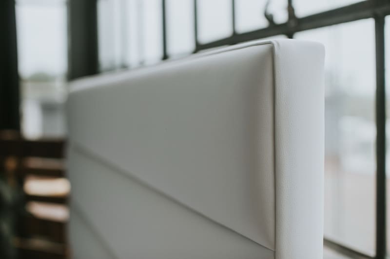 Top edge of the headboard: the channel seams up close