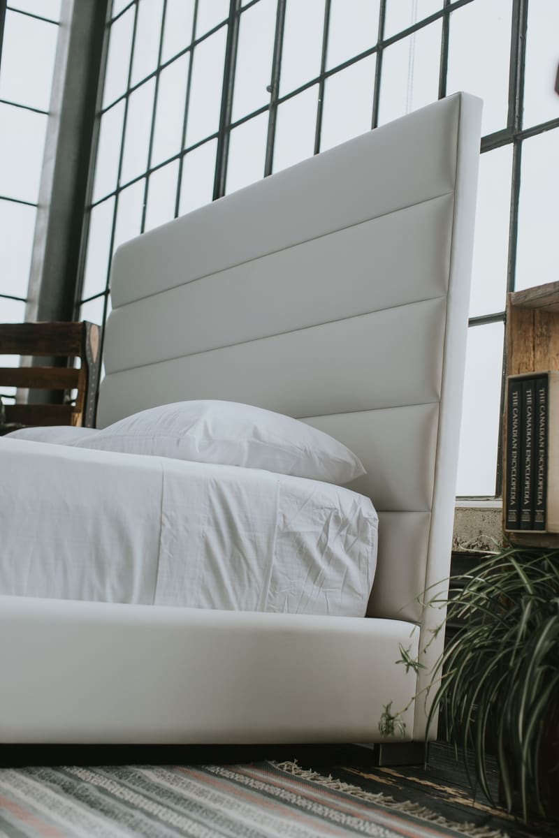 The headboard from the side, showing its depth and the channels