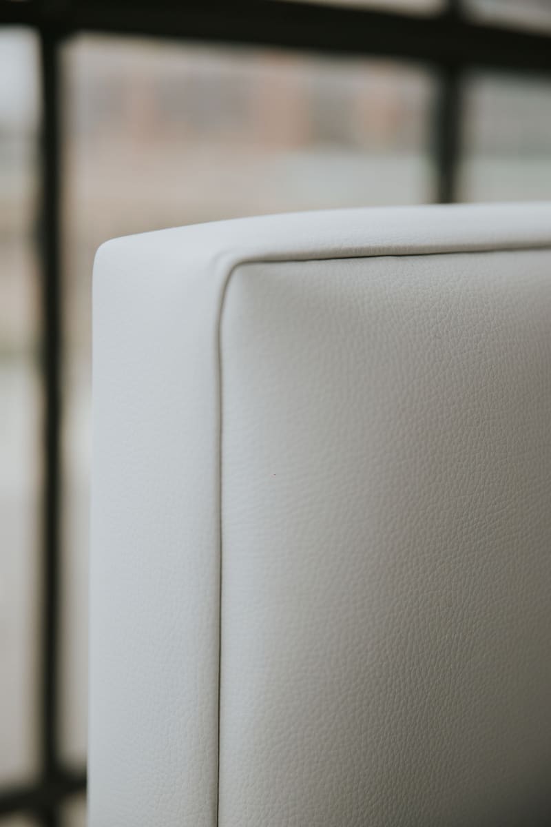 The grain of the white vegan leather up close