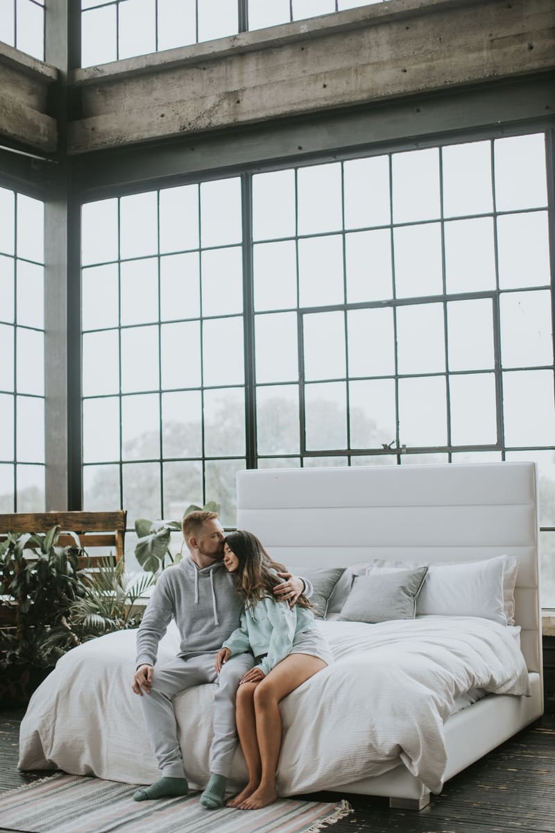 A couple on the Zazen Bed in a loft