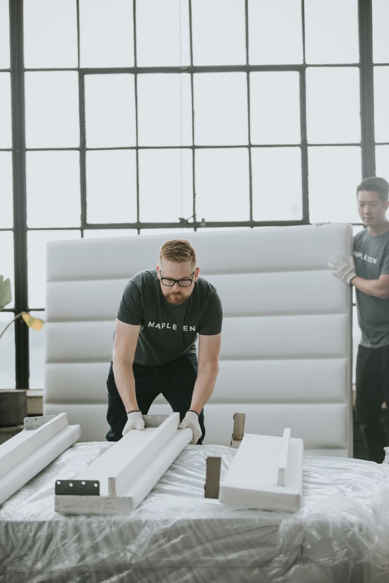 The Maple Zen team assembling a bed on delivery