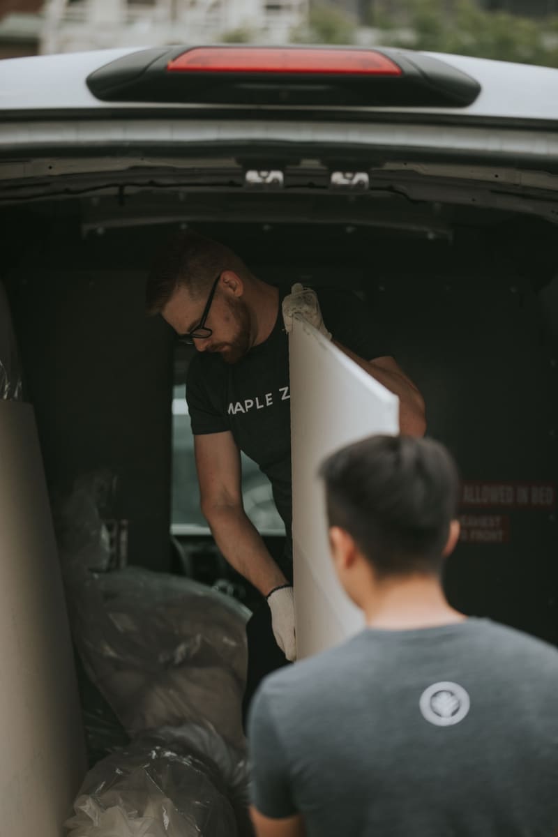 Loading a headboard into the delivery van
